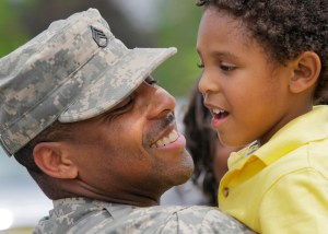 20090529TK 7/x Harry Young of Freehold, a member of the New Jersey National Guard 50th Infantry Brigade Combat Team, hugs his 3 year old son Cristian (cq) at Fort Dix after returning home from a year in Iraq. FORT DIX, NJ 5/29/09 2:23:11 PM TONY KURDZUK/THE STAR-LEDGER WireSelects: 05/30/09