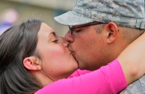 20090529TK 4/x Jessica Geronimo of Allenhurst gives her boyfriend Jorge Morejon of the New Jersey National Guard 50th Infantry Brigade Combat Team a long kiss after he retunrd this morning to Fort Dix after a year in Iraq. The two continued to kiss like this for 10 minutes as other soldiers greeted their family members around them. FORT DIX, NJ 5/29/09 2:28:57 PM TONY KURDZUK/THE STAR-LEDGER